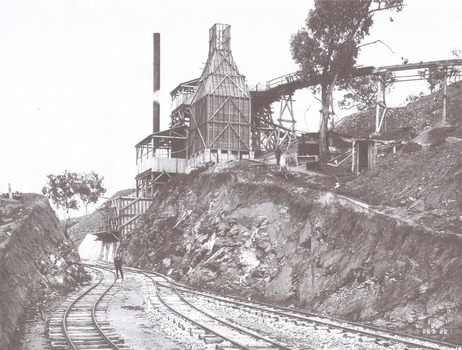 Quarry plant completed. A workman is on the tracks on the left foreground