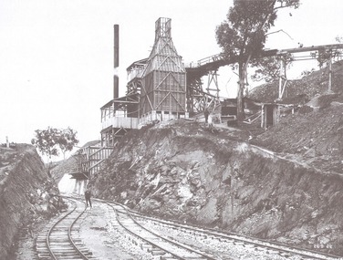 Quarry plant completed. A workman is on the tracks on the left foreground