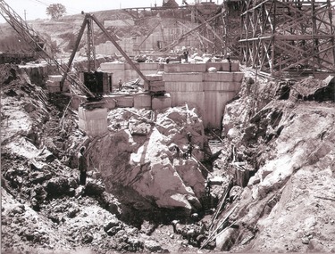  Work inside levee bank. Foundations of spillway showing granite foundations and a fault in the formation