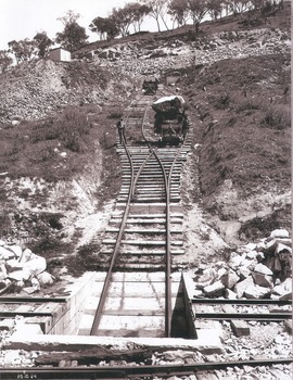 Gravity incline for transport of rocks. Rail tracks for trolleys moving up and down the incline