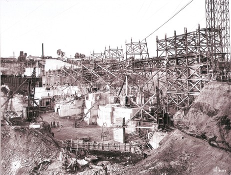 Work proceeding inside the coffer dam, August 1927. Taken from south wing wall foundation.