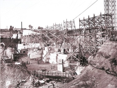 Work proceeding inside the coffer dam, August 1927. Taken from south wing wall foundation.