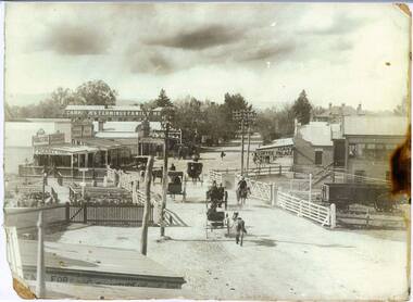 Railway gates in High Street, Wodonga in the foreground.  Carkeek's Terminus Hotel in the background.  
