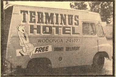 Delivery van for the Terminus Hotel featuring cartoon character delivery a barrel as well as the business telephone number