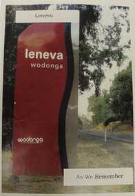 Leneva Wodonga road sign on the left with road and trees on the right.
