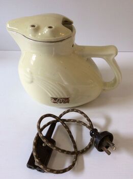 Side view of jug with electrical cord