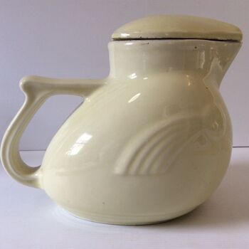 SIde view of crean coloured ceramic electric jug