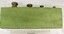 Side view of set of metric weights in holder with scale in centimetres