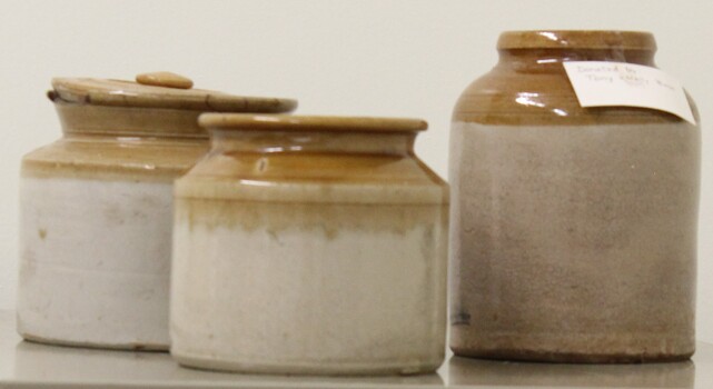 A group of 3 stoneware and ceramic canisters of assorted sizes