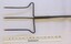 Head of toasting fork beside scale in centimetres