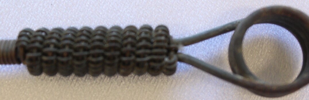 Handle of toasting fork with loop  for hanging up.