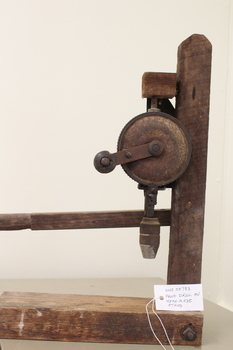 Front view of hand drill with tag