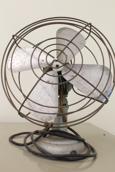 Electric Table fan - front view showing blades and protective wire grill.