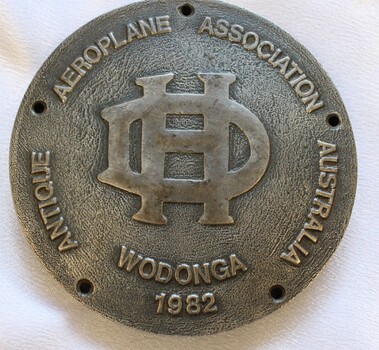 Antique Aeroplane Association Wodonga Medallion with the De Haviland logo in the centre.