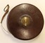 Retractable wire tape in leather casing