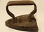 A small cast iron flat iron