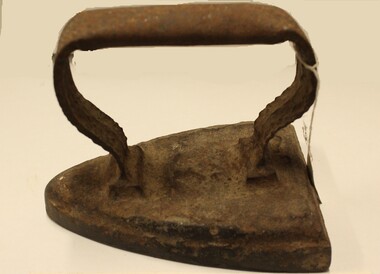 A small cast iron flat iron