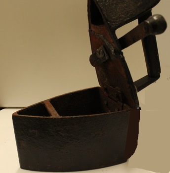 Charcoal Iron - open to reveal cavity for charcoal.