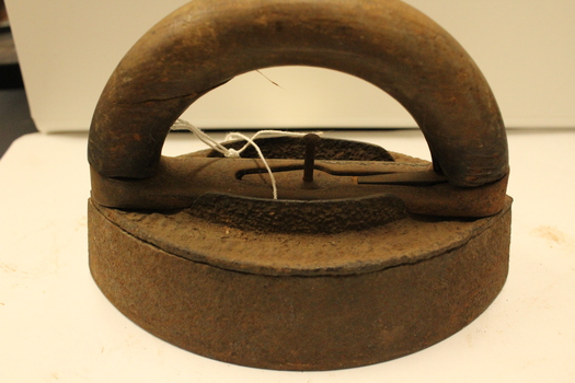 Flat/ sad iron with handle attached