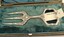 SIlver cake serving fork placed in case in fork shaped recess
