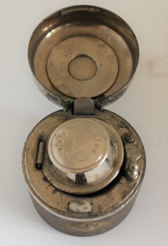 Travelling navy inkwell showing double lid with outer lid open