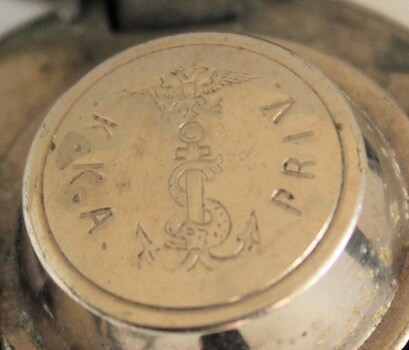 Insignia of double-headed eagle, anchor and serpent engraved on inner lid