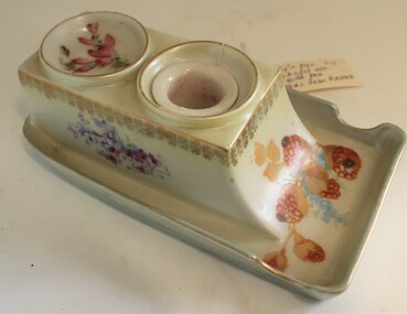 China pen and ink set with painted floral decorations.
