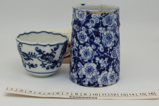 Jug and cup with horizontal scale in centimetres