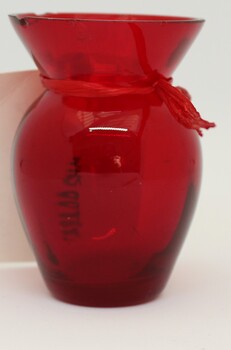 A small ruby ware vase.