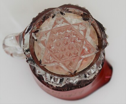 Base of jug with star pattern in  crystal.