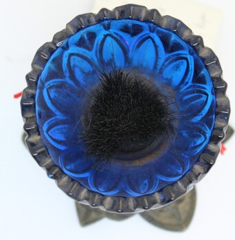 Top view showing black bristles inside used to clean pen nib