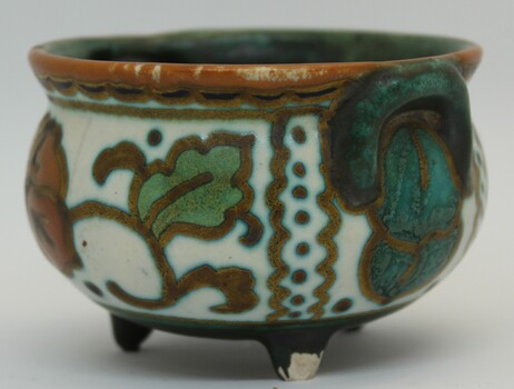 Leaf design on reverse side of pottery bowl