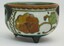 Painted orange floral design on bowl