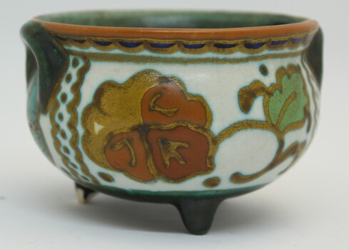 Painted orange floral design on bowl