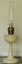 A white Bakelite Aladdin Kerosene lamp with pedestal and tall chimney