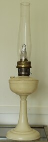 A white Bakelite Aladdin Kerosene lamp with pedestal and tall chimney