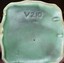 Trade Production Mark V210 underneath base.