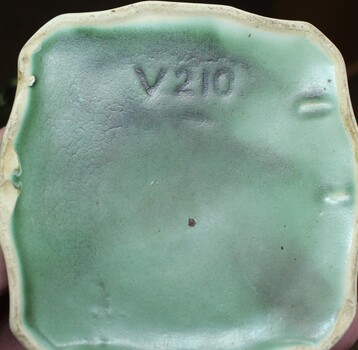 Trade Production Mark V210 underneath base.