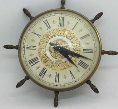 Nautical style Smith's Battery clock - round with Roman numerals and central gold pattern