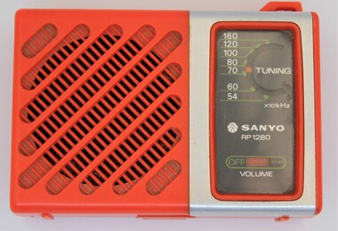 Orange plastic and metal Sanyo pocket radio 