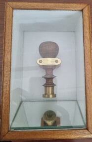 Belvoir Police Seal in timber and glass case with mirror in base