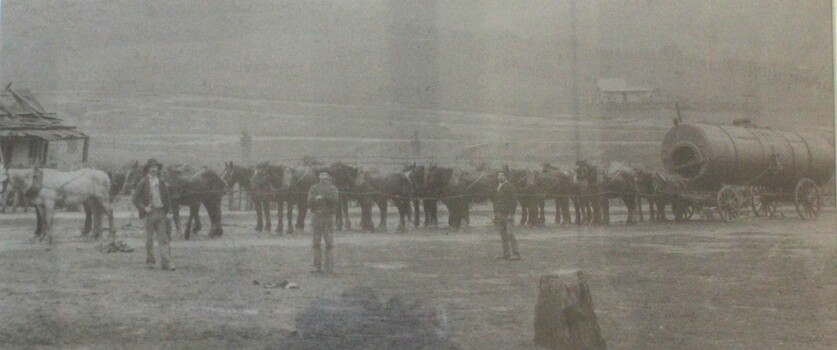 Teams of horses hauling a large boiler