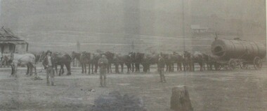 Teams of horses hauling a large boiler