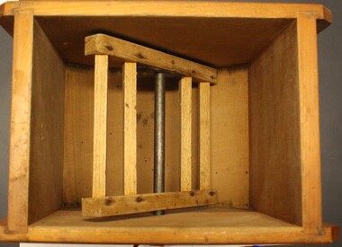 Inside view of butter churn showing paddle attached to handle