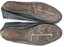 Sole of running shoes showing spikes. 96 marked on sole.
