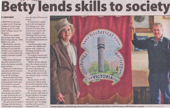 Article from the Border Mail "News Xpress"  Betty Barberis and John Flower, President of Wodonga Historical Society with the banner 22 July 2009
