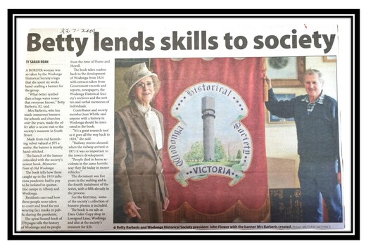 Article from the Border Mail "News Xpress"  Betty Barberis and John Flower, President of Wodonga Historical Society with the banner 22 July 2009