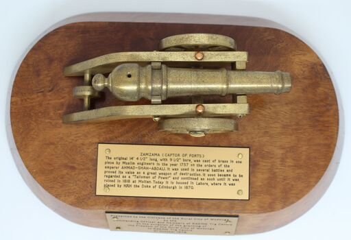 Commemorative award top view showing information plaque about cannon