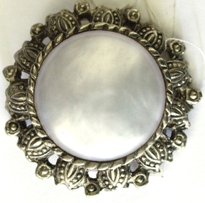 Circular silver and mother of pearl brooch