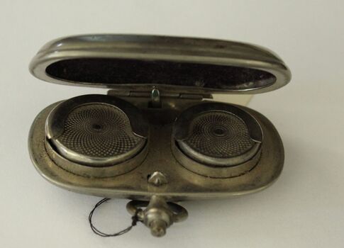 Small silver case with fob clip designed to hold sovereign and half sovereign coins,